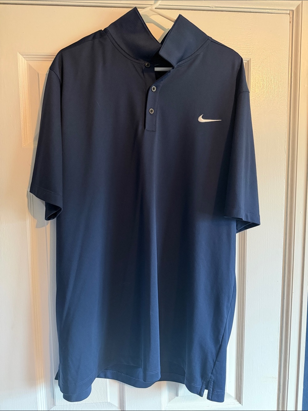 Nike Men’s Dark Blue Polo with White Swoosh